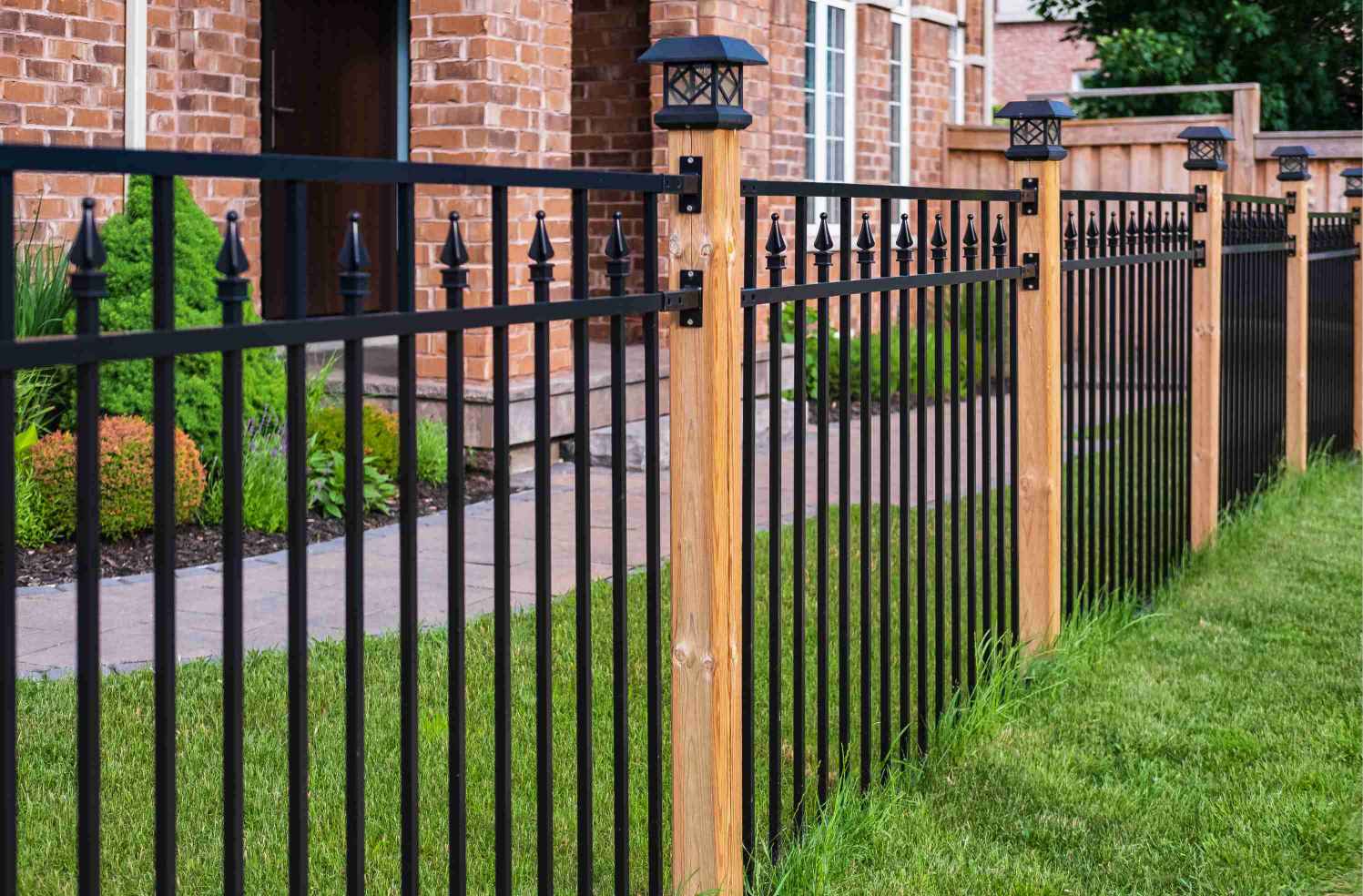 Wrought Iron Fence with Wood Pillars